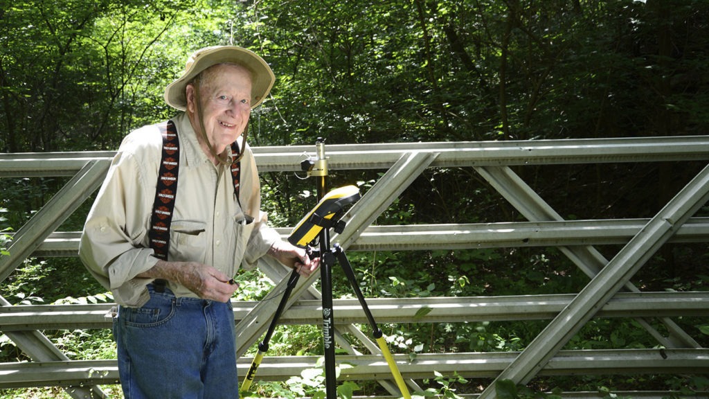 Bob Vollmer, at the age of 99, seen at work as a surveyor — more than a half-century after he took the job. Now 102, Vollmer says he's worn out his legs. But he still has big plans for life after retirement. CREDIT: John Maxwell/AP