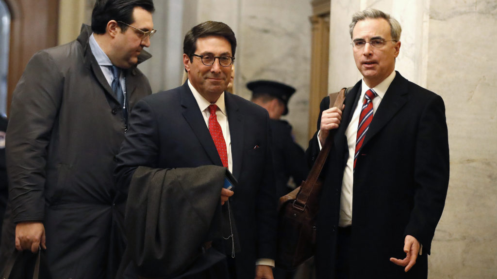 President Trump's personal attorney Jay Sekulow (center) stands with his son, Jordan Sekulow (left), and White House counsel Pat Cipollone in the Capitol on Saturday. CREDIT: Julio Cortez/AP