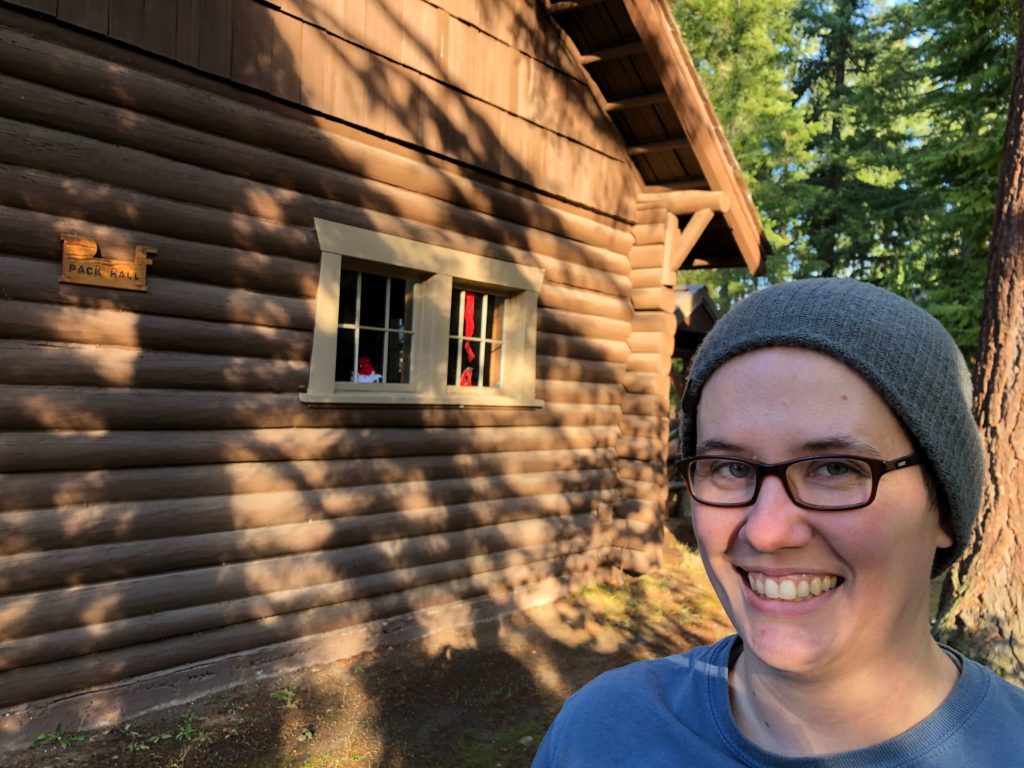 Amy Wilson, an education coordinator with the University of Washington, shows off the Pack Hall at UW's Pack Forest. The university might use the lodge as an emblem to brand its new bigleaf maple syrup. CREDIT: Anna King/N3