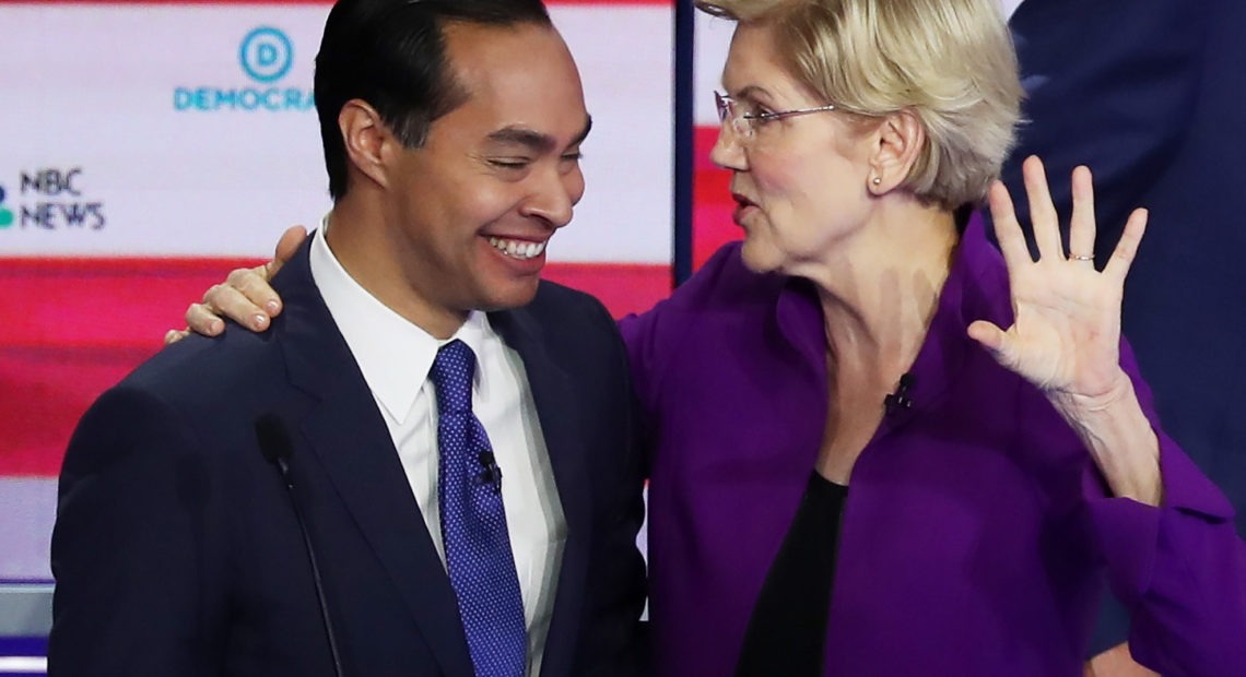 Former Housing Secretary Julián Castro and Massachusetts Sen. Elizabeth Warren embrace after a Democratic presidential debate on June 26 in Miami. CREDIT: Joe Raedle/Getty Images