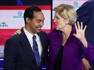 Former Housing Secretary Julián Castro and Massachusetts Sen. Elizabeth Warren embrace after a Democratic presidential debate on June 26 in Miami. CREDIT: Joe Raedle/Getty Images