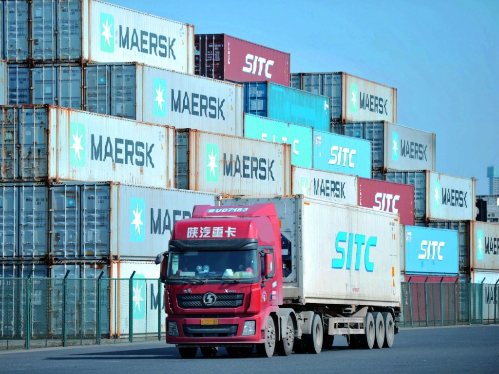 Containers are stacked at the port in Qingdao, in China's eastern Shandong province. A new trade deal dictates that China buy more from the U.S., but that has other trading partners worried. CREDIT: STR/AFP via Getty Images