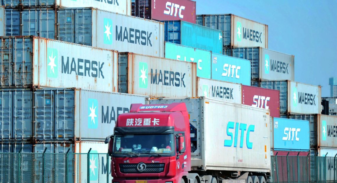 Containers are stacked at the port in Qingdao, in China's eastern Shandong province. A new trade deal dictates that China buy more from the U.S., but that has other trading partners worried. CREDIT: STR/AFP via Getty Images