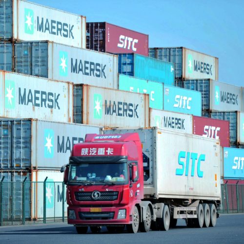 Containers are stacked at the port in Qingdao, in China's eastern Shandong province. A new trade deal dictates that China buy more from the U.S., but that has other trading partners worried. CREDIT: STR/AFP via Getty Images