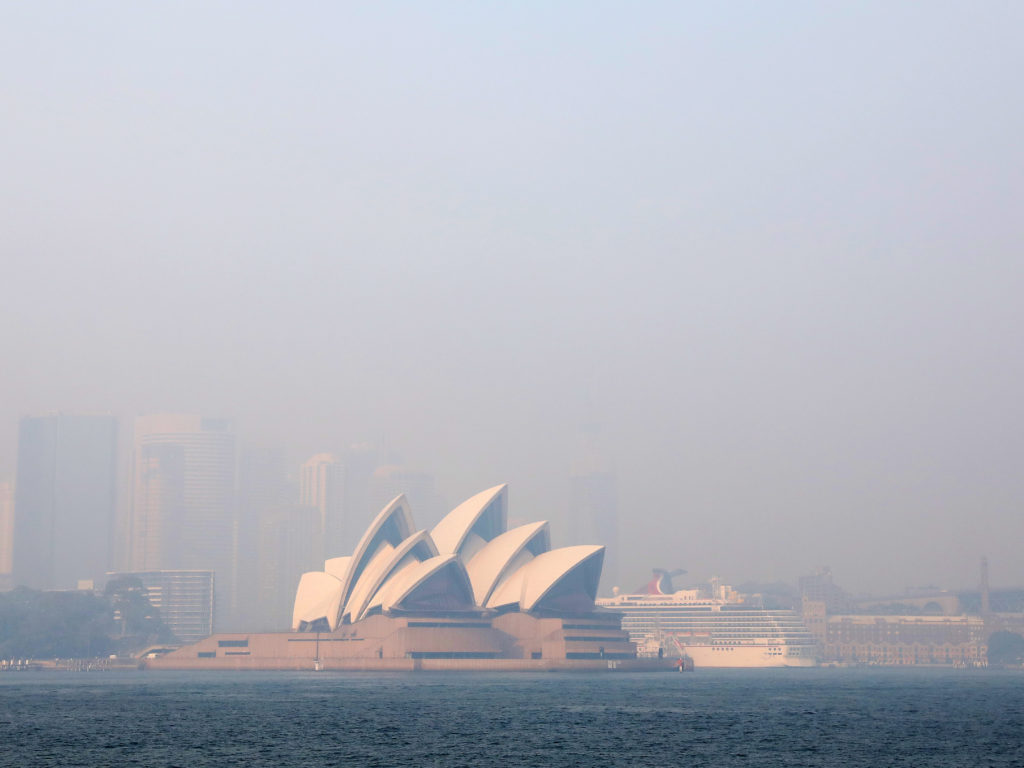 Much of New South Wales, Australia, including the Sydney Opera House, lay under a shroud of smoke Thursday. The state remains under severe or very high fire danger warnings as more than 60 fires continue to burn within its borders. CREDIT: Cassie Trotter/Getty Images