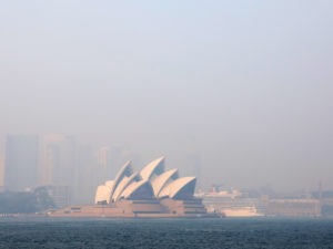 Much of New South Wales, Australia, including the Sydney Opera House, lay under a shroud of smoke Thursday. The state remains under severe or very high fire danger warnings as more than 60 fires continue to burn within its borders. CREDIT: Cassie Trotter/Getty Images