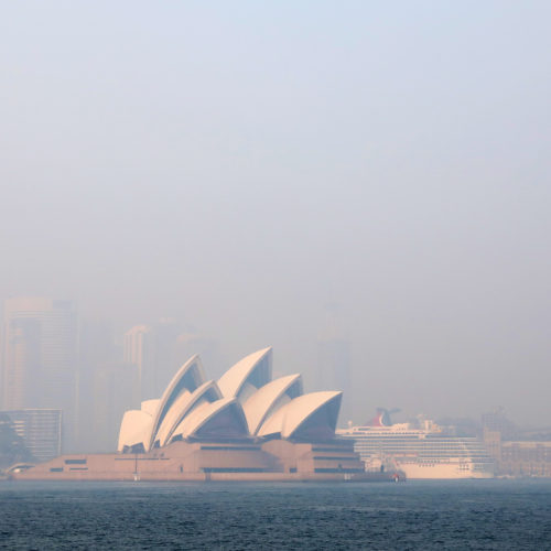 Much of New South Wales, Australia, including the Sydney Opera House, lay under a shroud of smoke Thursday. The state remains under severe or very high fire danger warnings as more than 60 fires continue to burn within its borders. CREDIT: Cassie Trotter/Getty Images