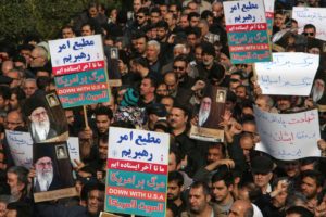 anians hold anti-U.S. banners during a demonstration in the capital, Tehran, following the killing of Qasem Soleimani by a U.S. drone strike.