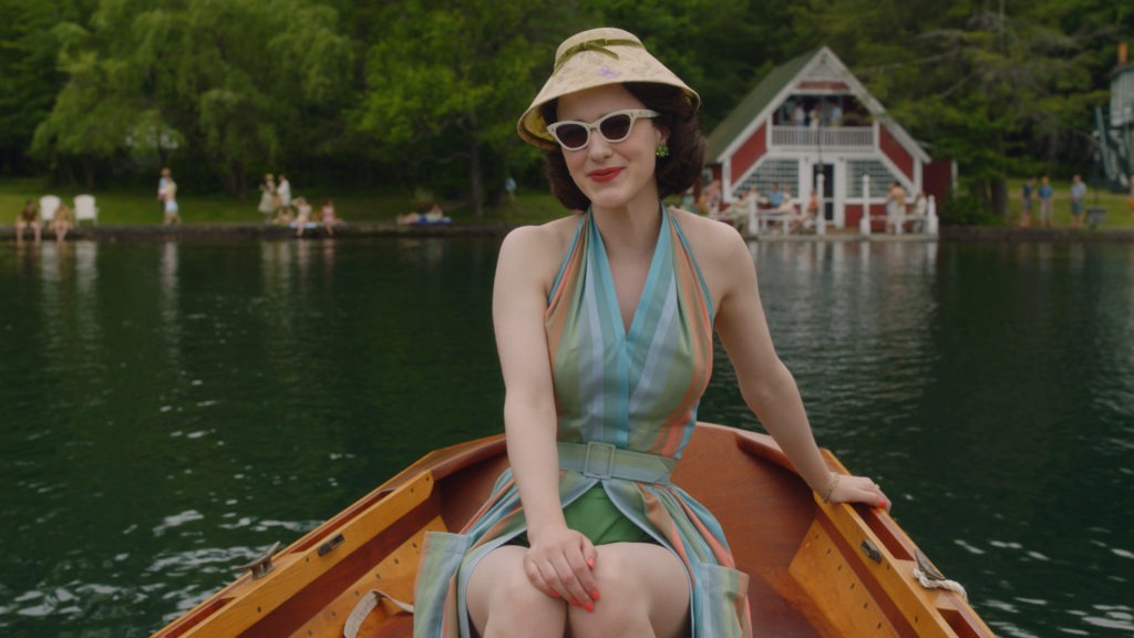 In the second season of The Marvelous Mrs. Maisel, Midge (Rachel Brosnahan) visits the Catskills. Costume designer Donna Zakowska says this outfit "in the boat with a funny lampshade hat" was among her favorites. CREDIT: Amazon Studios