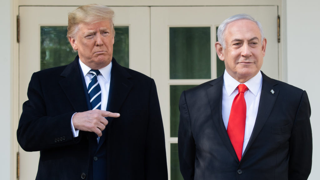 President Trump (left) and Israeli Prime Minister Benjamin Netanyahu speak to the media on the West Wing Colonnade ahead of meetings at the White House on Monday. CREDIT: Saul Loeb/AFP via Getty Images