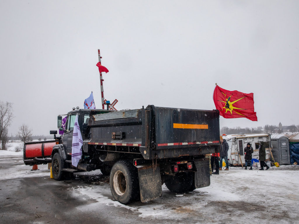 A truck sits parked at railway tracks during a protest near Belleville, Ontario, Canada, on Thursday. Demonstrators have been disrupting railroads and other infrastructure across Canada for more than a week to protest the planned Coastal GasLink pipeline. CREDIT: Bloomberg via Getty Images