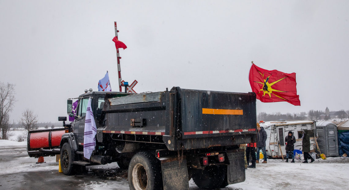 A truck sits parked at railway tracks during a protest near Belleville, Ontario, Canada, on Thursday. Demonstrators have been disrupting railroads and other infrastructure across Canada for more than a week to protest the planned Coastal GasLink pipeline. CREDIT: Bloomberg via Getty Images