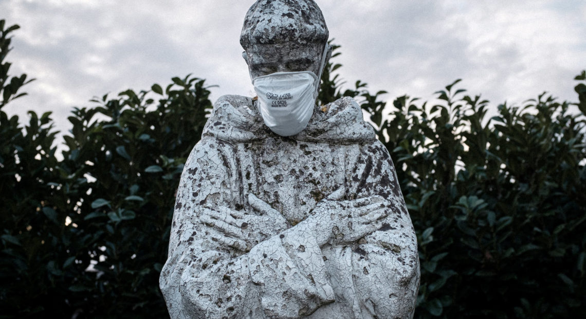 A face mask adorns a statue of St. Francis of Assisi in the town of San Fiorano, one of the places in Italy on lockdown due to the novel coronavirus outbreak. The picture was taken by schoolteacher Marzio Toniolo. Marzio Toniolo/via Reuters