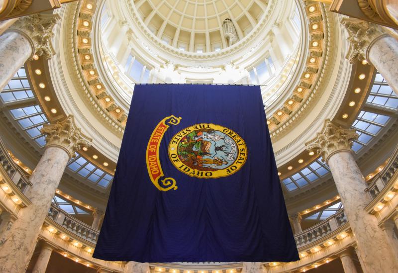 The Idaho state flags hangs in the rotunda of the statehouse in Boise