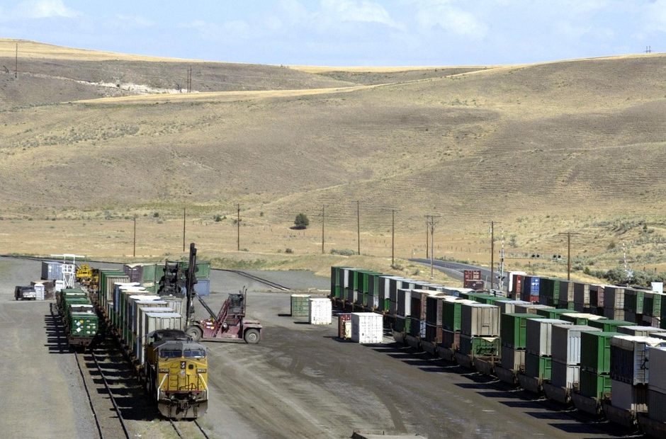 Garbage, hauled in by train from long distances, is unloaded onto trucks for transfer to the landfill in the barren, rolling hills near Arlington, Ore., Aug. 3, 2004.