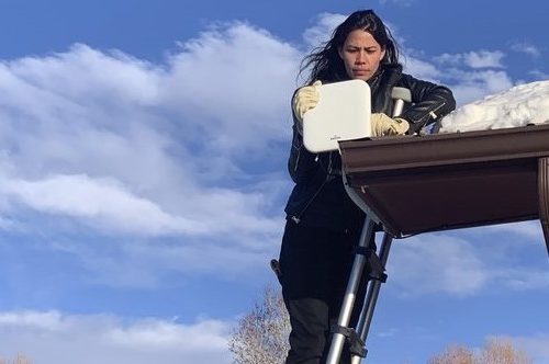 Mariel Triggs, chief executive of MuralNet, tests broadband internet equipment in Fort Washakie on the Wind River Indian Reservation in Wyoming. CREDIT: Patrick Lawson via AP