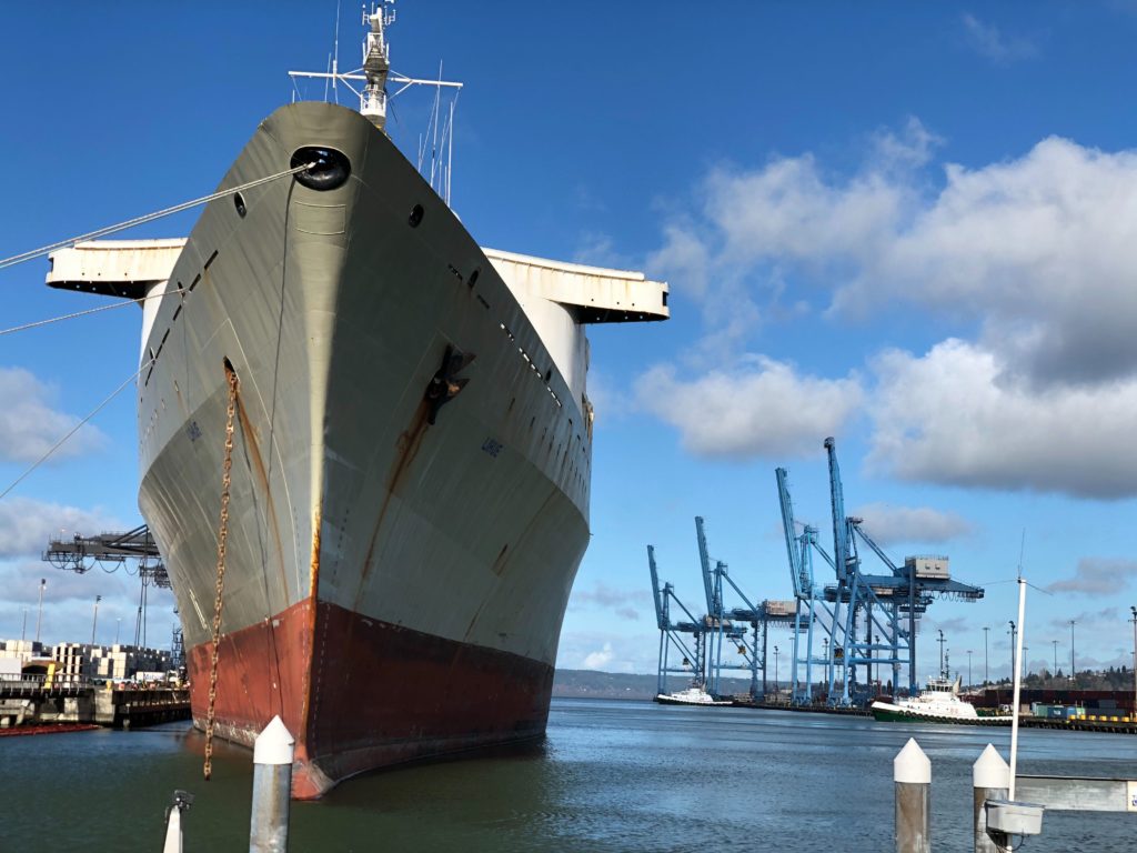 At Washington's Port of Tacoma, cargo containers and ships are moving much more slowly back from China while U.S. commodities are competing for space to ship out. CREDIT: Anna King/N3