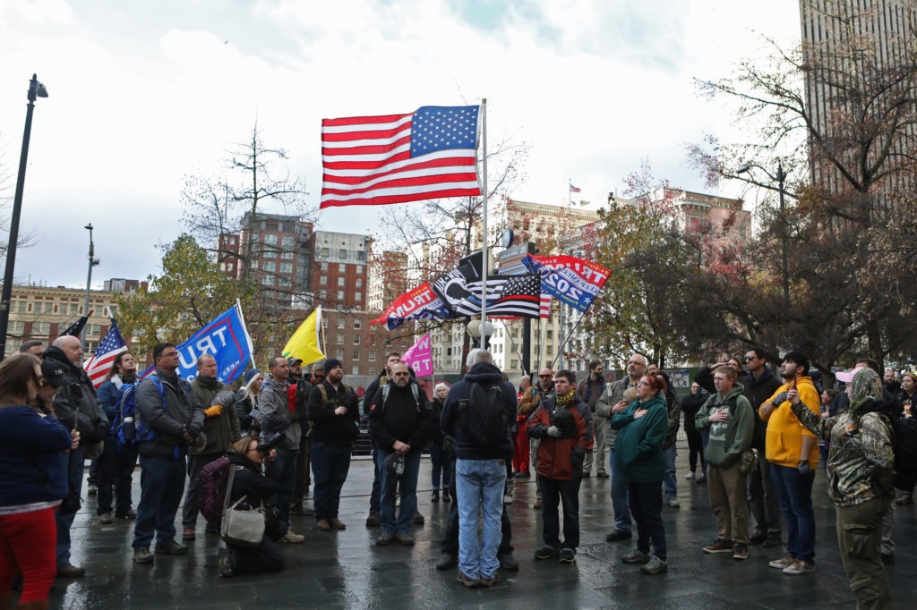 When members of the Washington Three Percent rallied in Seattle in January 2020, leftists with whom they have communicated with in the past showed up to protest. Jim Urquhart for NPR