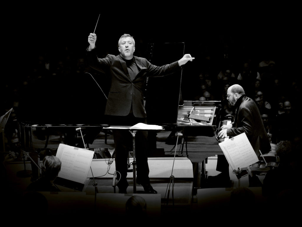 British composer Thomas Adès leads the Boston Symphony Orchestra, and soloist Kirill Gerstein, in the premiere performances of his Concerto for Piano and Orchestra at Symphony Hall in Boston. CREDIT: Winslow Townson/Deutsche Grammophon