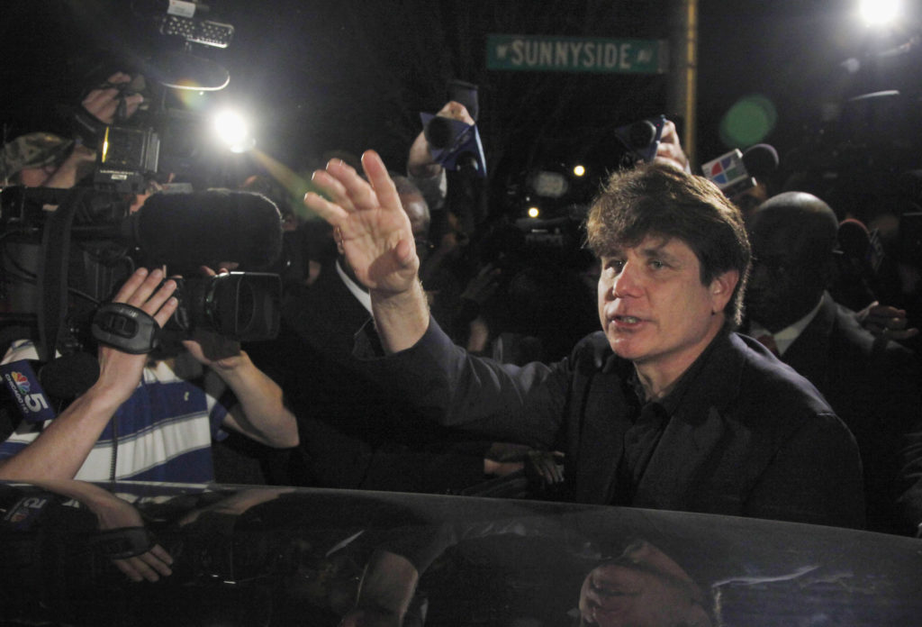 Former Illinois Gov. Rod Blagojevich departs his Chicago home in 2012. On Tuesday, Trump commuted the 14-year sentence of Blagojevich, who has been serving a prison term after being convicted on corruption charges. CREDIT: Charles Rex Arbogast/AP