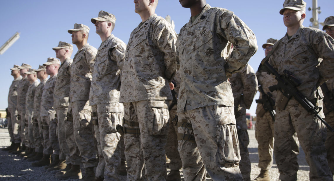 U.S. Marines stand guard during the change of command ceremony at Shorab military camp in Afghanistan's Helmand province in January 2018. CREDIT:; Massoud Hossaini/AP