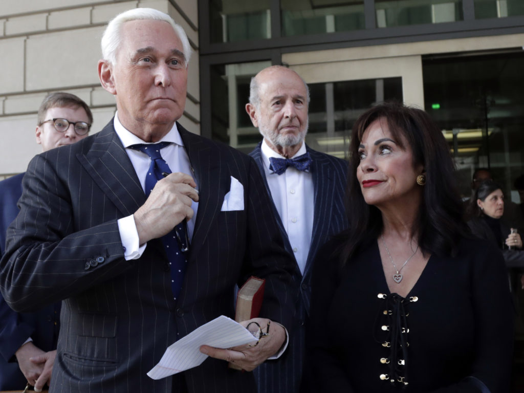 Roger Stone leaves federal court with his wife, Nydia Stone, on the day he was found guilty last fall. CREDIT: Julio Cortez/AP