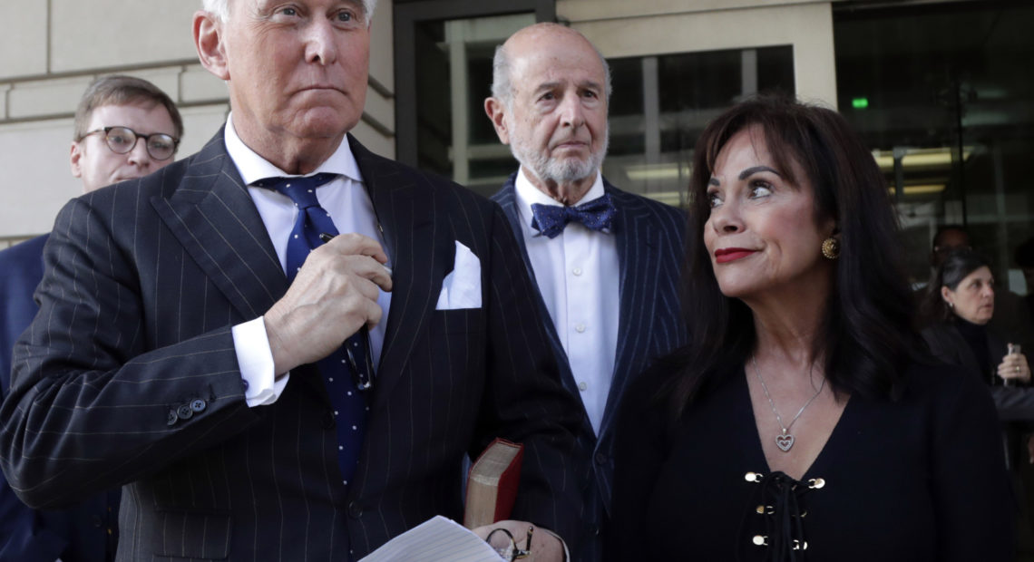 Roger Stone leaves federal court with his wife, Nydia Stone, on the day he was found guilty last fall. CREDIT: Julio Cortez/AP