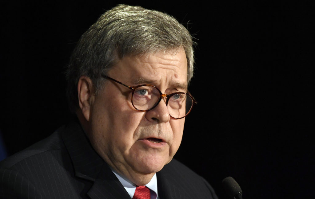 President Trump has congratulated Attorney General William Barr for "taking charge" of the Roger Stone case. Susan Walsh/AP