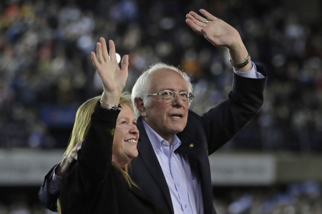 Democratic presidential candidate Sen. Bernie Sanders, I-Vt., waves with his wife, Jane, after his speech at a campaign event in Tacoma, Wash., on Feb. 17.