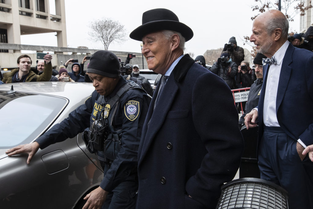 Roger Stone, center, departs federal court in Washington on Thursday. Alex Brandon/AP