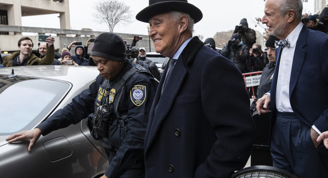 Roger Stone, center, departs federal court in Washington on Thursday. Alex Brandon/AP