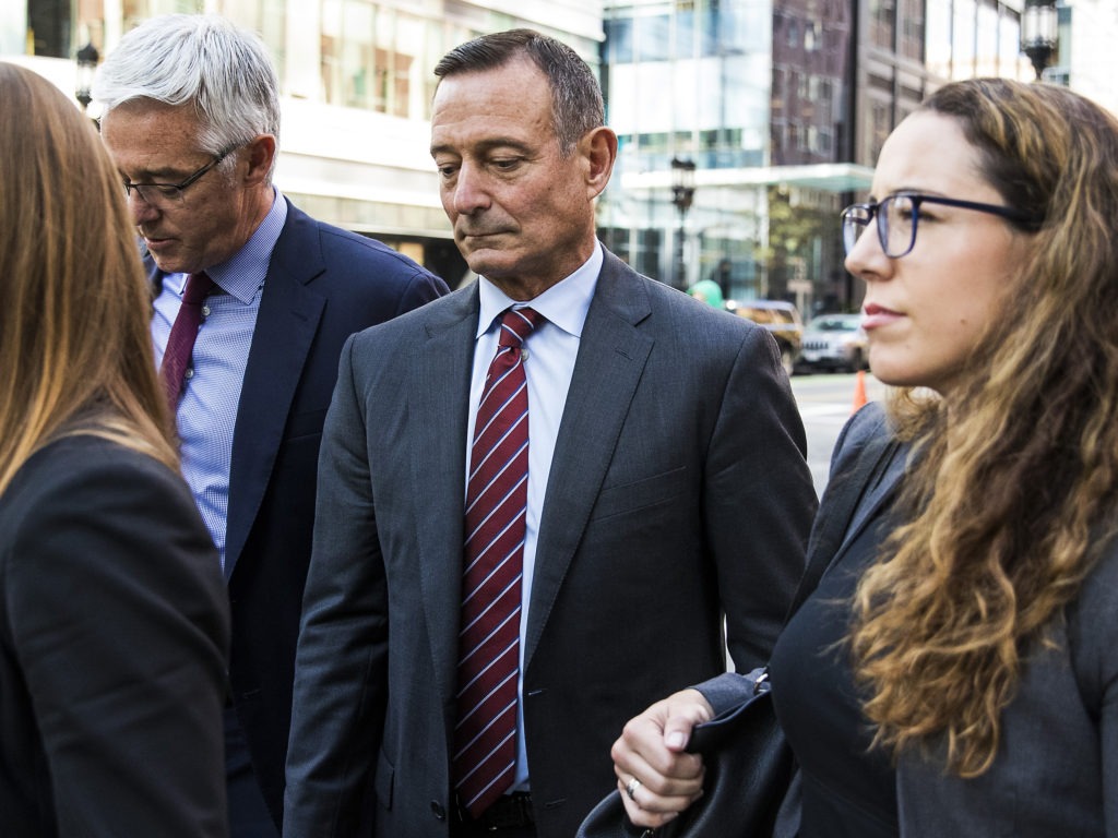 Douglas Hodge, shown in October 2019, outside the federal courthouse in Boston, has been sentenced to nine months in prison. CREDIT: Bloomberg/Bloomberg via Getty Images