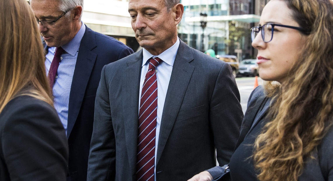 Douglas Hodge, shown in October 2019, outside the federal courthouse in Boston, has been sentenced to nine months in prison. CREDIT: Bloomberg/Bloomberg via Getty Images