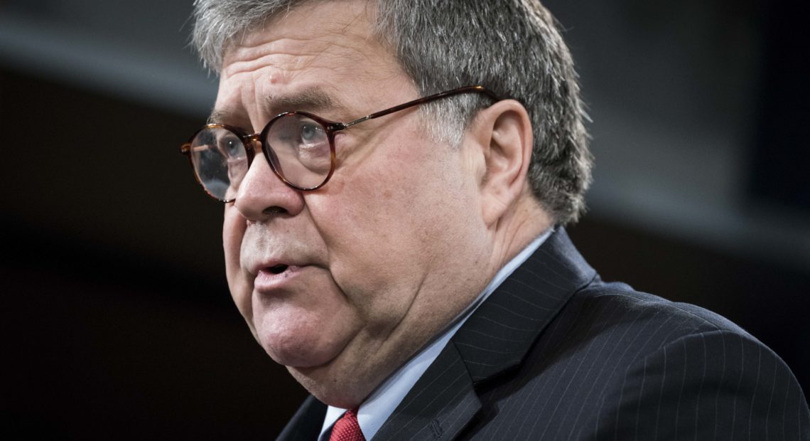 Attorney General William Barr, pictured during a news conference on Monday, tells ABC News that President Trump should stop his commentary about ongoing Justice Department cases. CREDIT: Sarah Silbiger/Getty Images