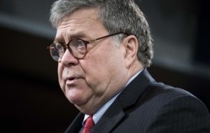 Attorney General William Barr, pictured during a news conference on Monday, tells ABC News that President Trump should stop his commentary about ongoing Justice Department cases. CREDIT: Sarah Silbiger/Getty Images