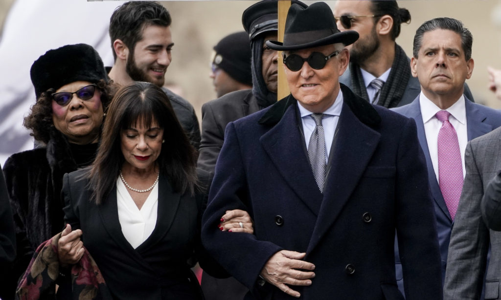 Roger Stone, former adviser to President Trump, arrives at the E. Barrett Prettyman U.S. Courthouse on Thursday in Washington, D.C., with his wife, Nydia. CREDIT: Drew Angerer/Getty Images