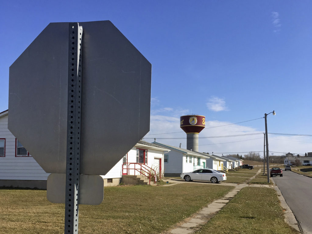 Residential roads with no street name or number signs such as this one in Belcourt, N.D., are common on the Turtle Mountain Indian Reservation. Blake Nicholson/AP