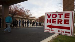 Voters wait in line as the polls open at Pierce Park Baptist Church in Boise, Idaho, Tuesday, Nov. 6, 2018. CREDIT: Otto Kitsinger/AP