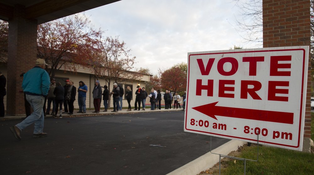 Voters wait in line as the polls open at Pierce Park Baptist Church in Boise, Idaho, Tuesday, Nov. 6, 2018. CREDIT: Otto Kitsinger/AP