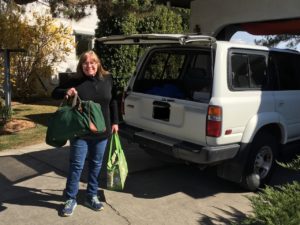 Diana Moeller holding luggage to move back home.