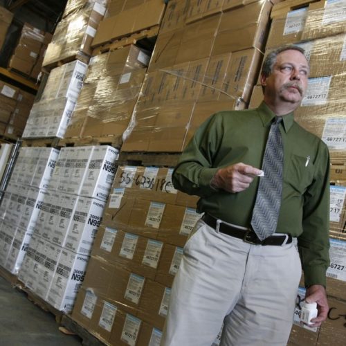 File photo. Don Wood, an official with the Strategic National Stockpile, awaits another truck load of medications in Salt Lake City, Utah during a swine flu outbreak from the H1N1 virus in 2009. The pandemic that year prompted the largest use to date of the stockpile, which was created in 1999. It has never confronted anything on the scale of the current COVID-19 pandemic. CREDIT: Francisco Kjolseth/AP