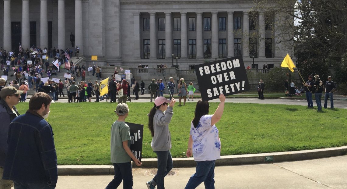 Protesters rally against social-distancing measures at the Washington state Capitol on April 19, 2020. CREDIT: Will James / KNKX