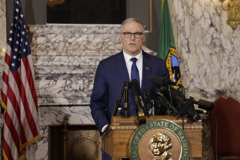 Washington Gov. Jay Inslee announces the closing of all K-12 schools in three Washington counties on Thursday, March 12, 2020. The closure was extended statewide on Friday for at least six weeks. CREDIT: Rachel La Corte/AP