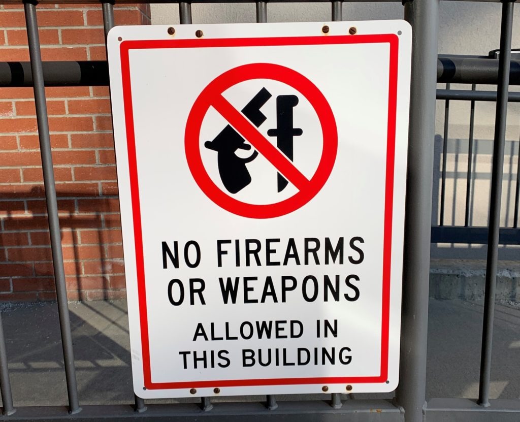 A "No Firearms" sign outside of the Bonner County Courthouse in Sandpoint, where the case, Bonner County v. City of Sandpoint, is being heard. CREDIT: Nick Deshais/N3