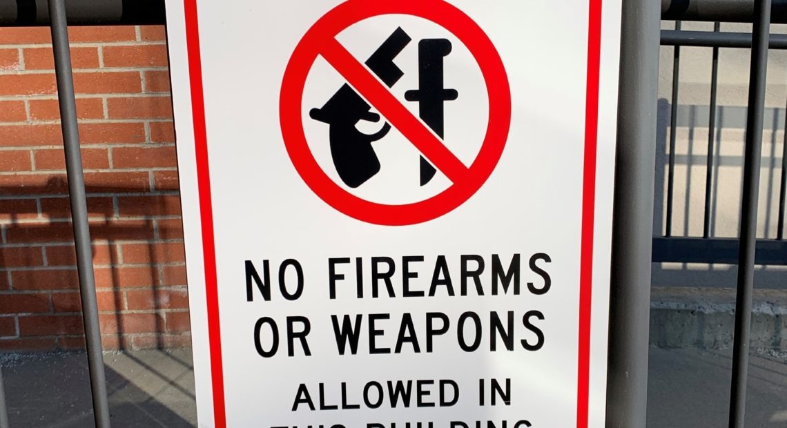 A "No Firearms" sign outside of the Bonner County Courthouse in Sandpoint, where the case, Bonner County v. City of Sandpoint, is being heard. CREDIT: Nick Deshais/N3