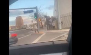 Motorists captured video of Yakima County Jail escaping over a fence on Monday, March 23. CREDIT: Briseida & Alex Gonzalez / screengrab video / KAPP-KVEW