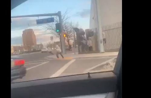 Motorists captured video of Yakima County Jail escaping over a fence on Monday, March 23. CREDIT: Briseida & Alex Gonzalez / screengrab video / KAPP-KVEW
