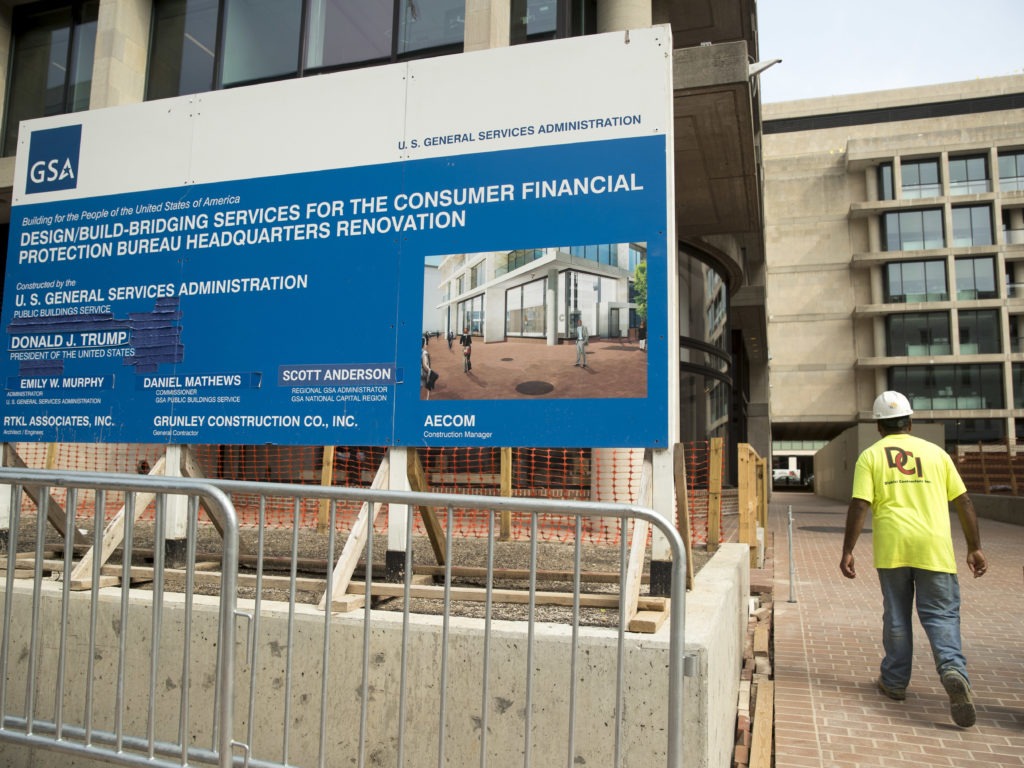A sign stands at the construction site for the Consumer Financial Protection Bureau's new headquarters in Washington. CREDIT: Andrew Harnik/AP