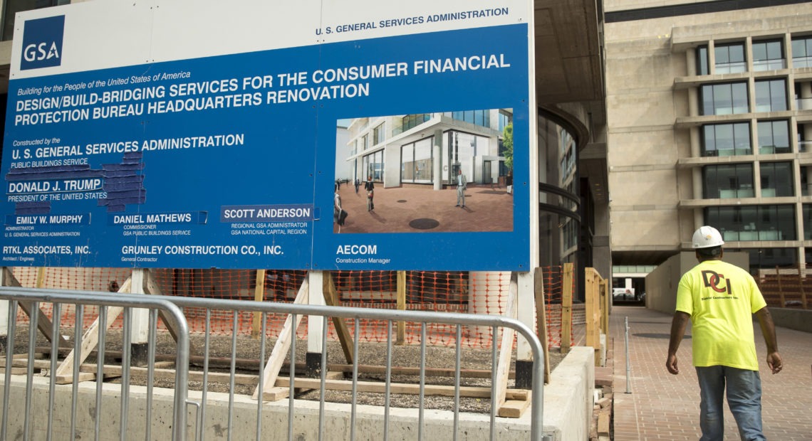 A sign stands at the construction site for the Consumer Financial Protection Bureau's new headquarters in Washington. CREDIT: Andrew Harnik/AP