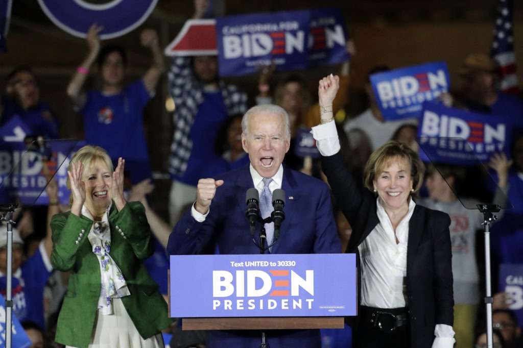 Joe Biden speaks at a campaign rally in Los Angeles with his wife Jill and his sister Valerie. The former vice president rode a wave of momentum that may have catapulted him back into front-runner status. Chris Carlson/AP